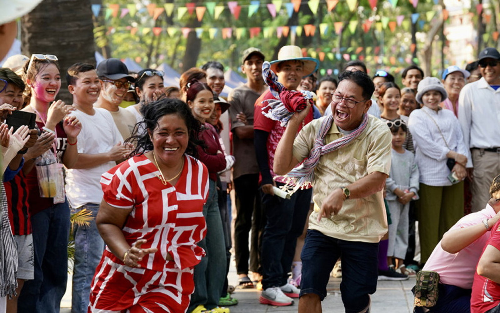 Cambodian families and friends enjoying Khmer New Year street games